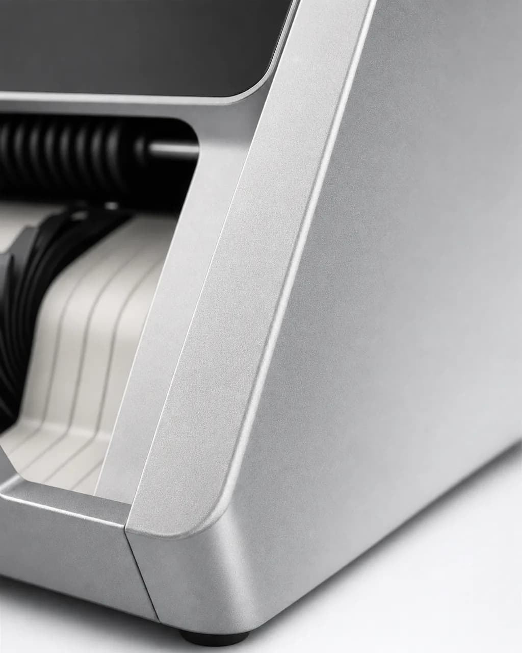 Macro of the chamfered aluminum edge beside the output tray